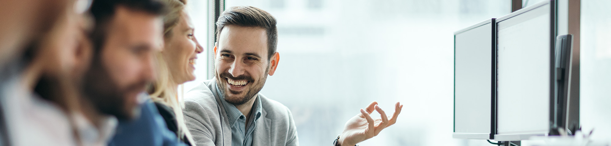 People Laughing In Office Setting